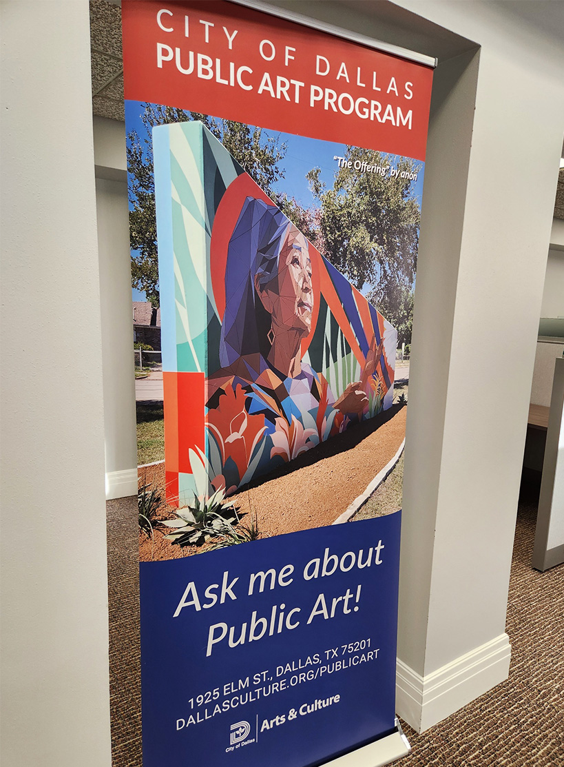 The Offering by Anón featured on the City of Dallas Public Art Program banner, displayed in the Dallas Office of Arts & Culture
